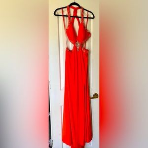 Red/orange jewel halter gown with slit.